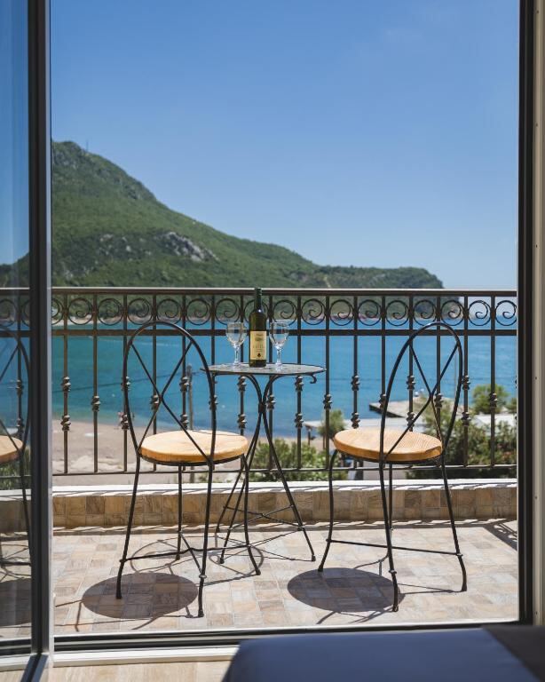Table for two on a private balcony facing Čanj bay